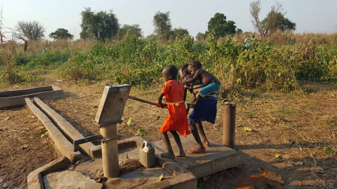 Children using a water pump in South Sudan. File photograph for water-access context; not the reported Jonglei mission.