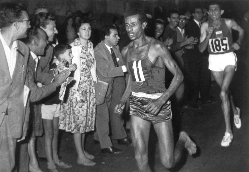 Abebe Bikila pulling away from Rhadi Ben Abdesselam near the end of the 1960 Olympic marathon in Rome.