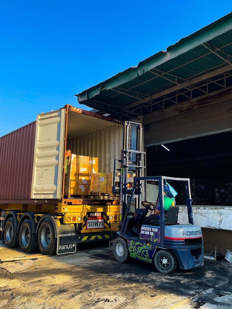 A forklift loading a container at a warehouse in Thailand. File illustration; no claim that the equipment is leased or ELRA-registered.