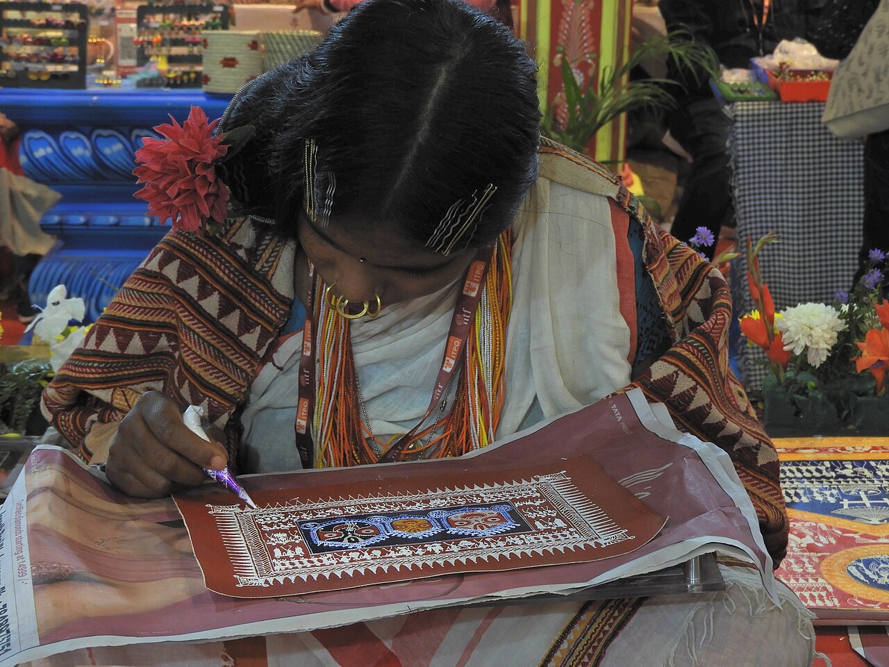 A craft worker at the India International Trade Fair in 2023. File illustration of a small-business exhibition, not the announced Lagos conference.