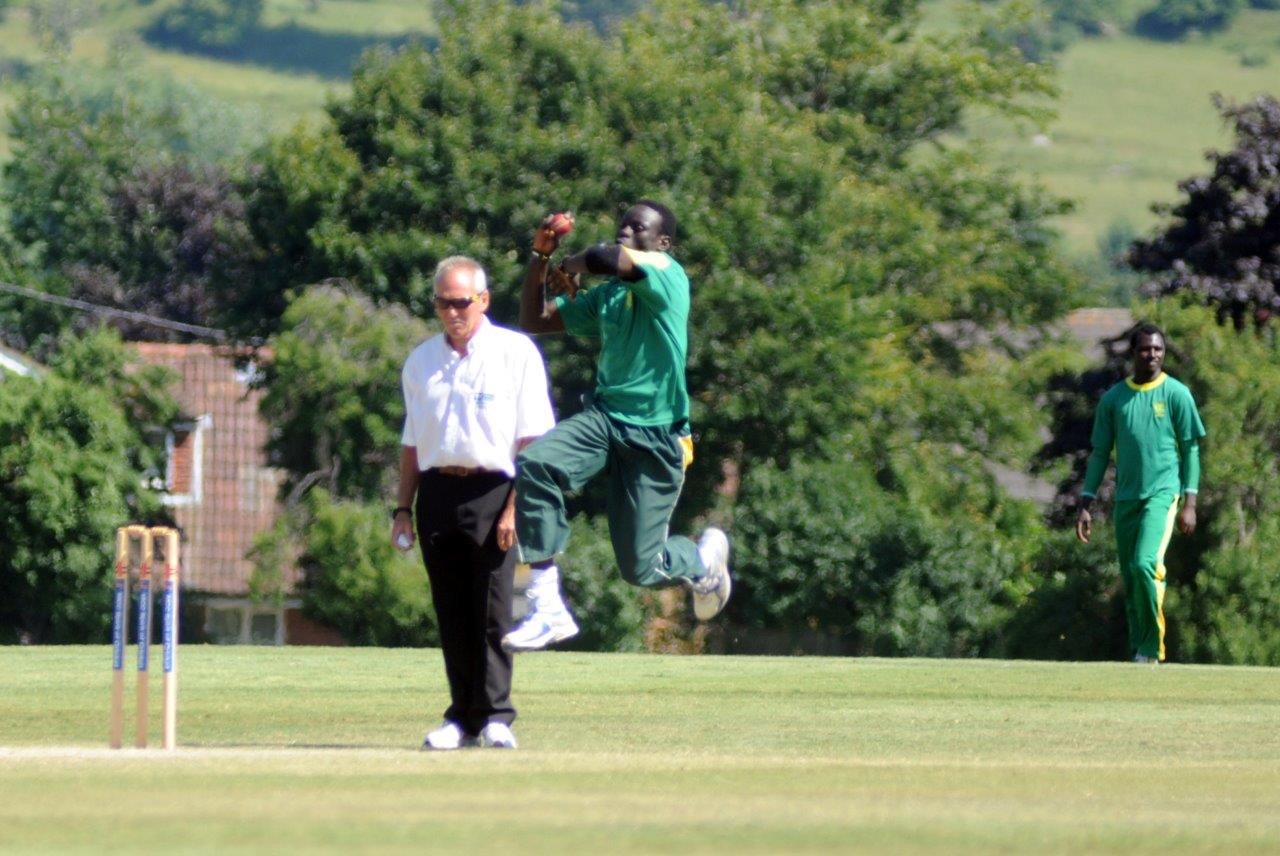 Saheed Akolade bowling for Nigeria in Jersey in 2013. File photograph, not the October 2026 match in Abuja.